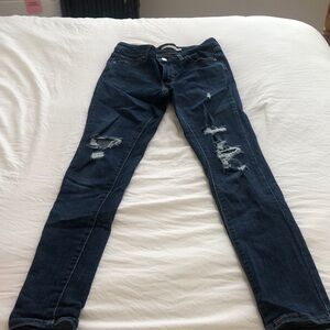 Women’s Levi’s jeans. Distressing on legs. Skinny cut. Size 26